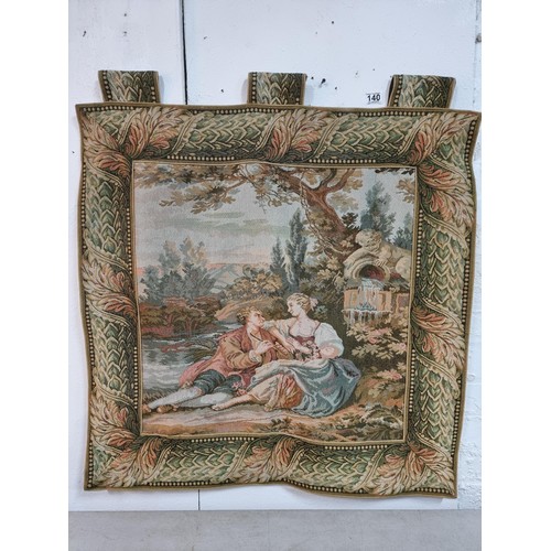 140 - Good quality wall hanging tapestry of a lovers scene in good order with a leaf decoration border, me... 