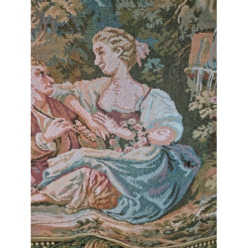 140 - Good quality wall hanging tapestry of a lovers scene in good order with a leaf decoration border, me... 