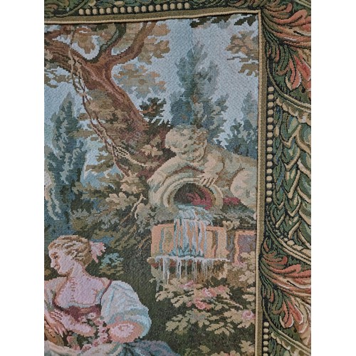 140 - Good quality wall hanging tapestry of a lovers scene in good order with a leaf decoration border, me... 