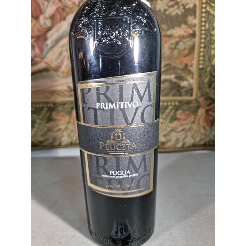 146 - Bottle of 75cl Primitivo Puglia red wine, bottle has had the top seal removed but hasn't been opened