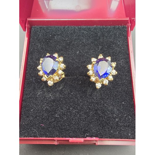 179 - A pair of pretty gold plate on 925 silver stud earrings inset with a real large blue sapphire gemsto... 