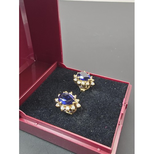 179 - A pair of pretty gold plate on 925 silver stud earrings inset with a real large blue sapphire gemsto... 