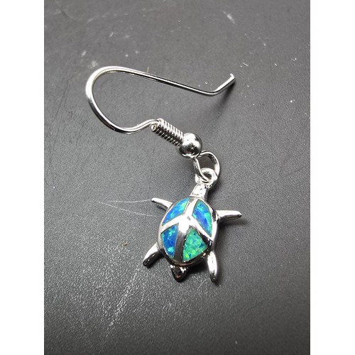 181 - A pair of pretty brand new silver tone earrings in the form of a turtle inset with real opal present... 