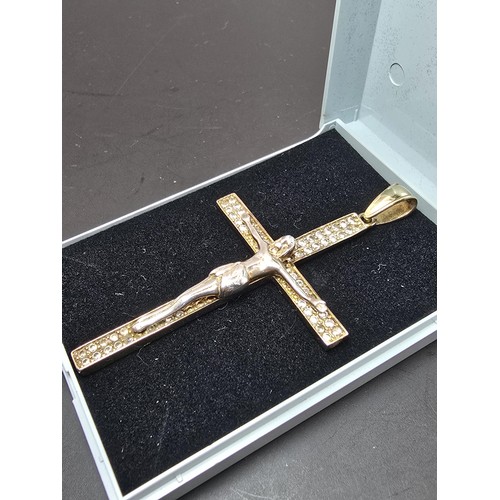 183 - A good quality 925 silver gold plated Crucifix pendant made to a high standard, featuring a well cas... 