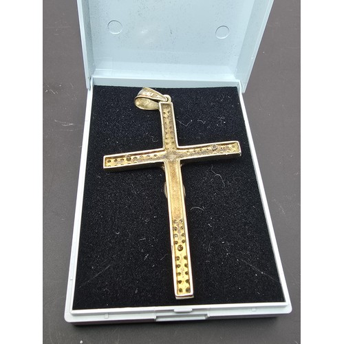 183 - A good quality 925 silver gold plated Crucifix pendant made to a high standard, featuring a well cas... 