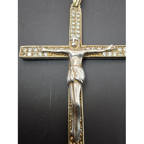 183 - A good quality 925 silver gold plated Crucifix pendant made to a high standard, featuring a well cas... 