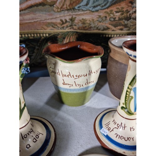 152 - Shelf full of collectable inc a quantity of Torquay ware inc candlesticks, jug and bowl along with h... 