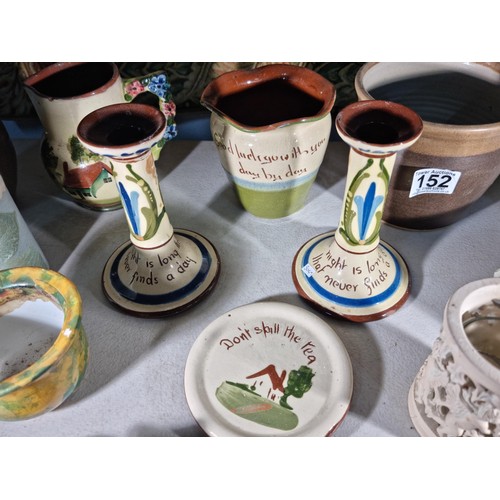 152 - Shelf full of collectable inc a quantity of Torquay ware inc candlesticks, jug and bowl along with h... 