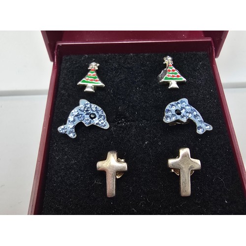 187 - A bundle of 3 pairs of 925 silver stud earrings to include a Cross pair, a dolphin pair and a Christ... 