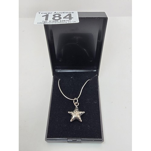 184 - A pretty 925 silver hand hammered star pendant set on a good 925 silver 22