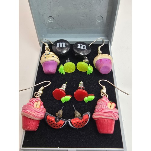 190 - A bundle of 6 pairs of novelty costume earrings to include pairs relating to cupcakes, M&M's, fruit ... 