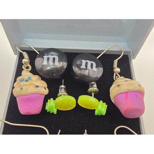 190 - A bundle of 6 pairs of novelty costume earrings to include pairs relating to cupcakes, M&M's, fruit ... 