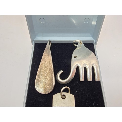 191 - A bundle of 3 good 925 silver large pendants to include an unusual stylized elephant pendant, a silv... 