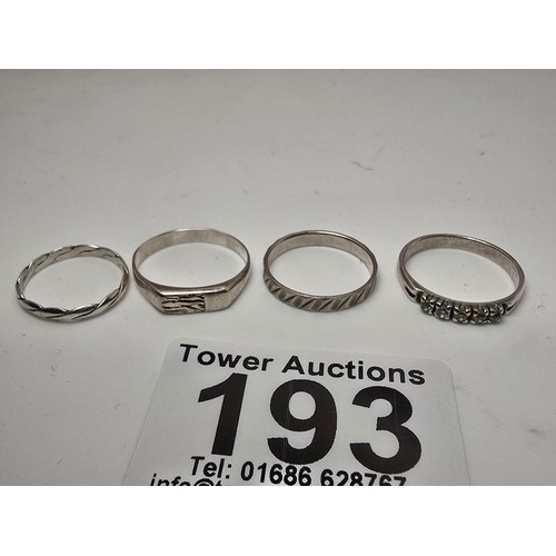 193 - A bundle of 4x 925 silver rings in various designs which includes a 5 stone ring inset with crystal ... 