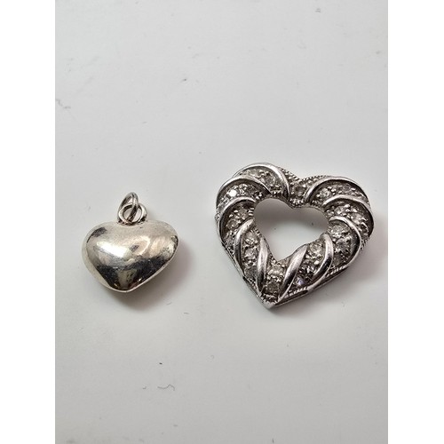 198 - 2x heart formed 925 silver pendants, 1 is of a solid heart design the other is of a pierced design, ... 