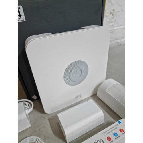 154 - Boxed Ring alarm system with key pad, sensor speaker and connection cables etc please see pictures f... 