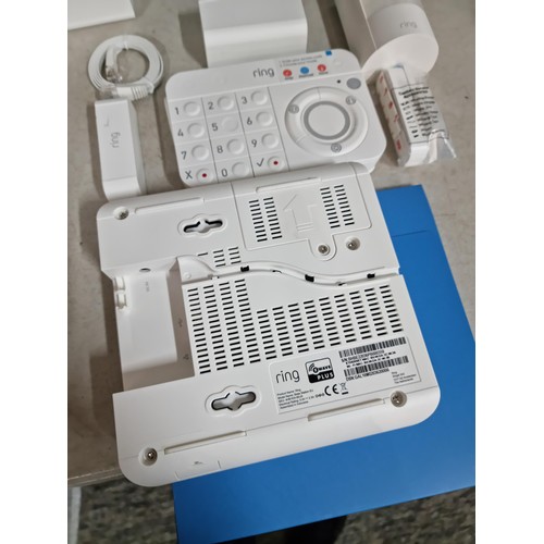 154 - Boxed Ring alarm system with key pad, sensor speaker and connection cables etc please see pictures f... 