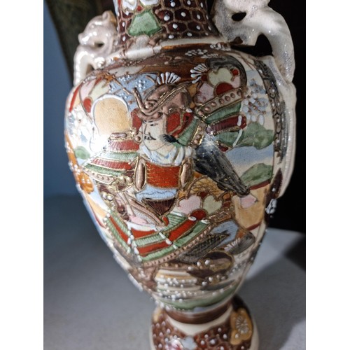 157 - Pair of hand painted oriental vases with a warrior to the front, with seahorse style handles to the ... 