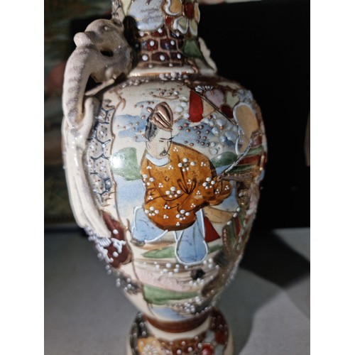 157 - Pair of hand painted oriental vases with a warrior to the front, with seahorse style handles to the ... 