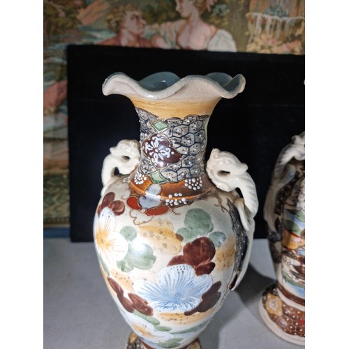 157 - Pair of hand painted oriental vases with a warrior to the front, with seahorse style handles to the ... 