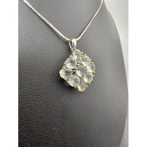 203 - A pretty 925 silver cluster pendant inset with faceted rock crystal gemstones (quartz) on a 16