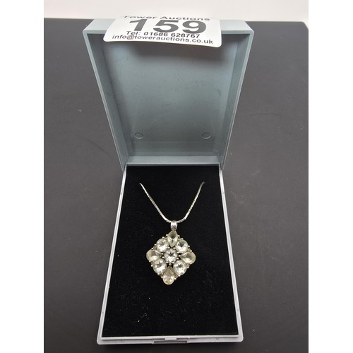 203 - A pretty 925 silver cluster pendant inset with faceted rock crystal gemstones (quartz) on a 16