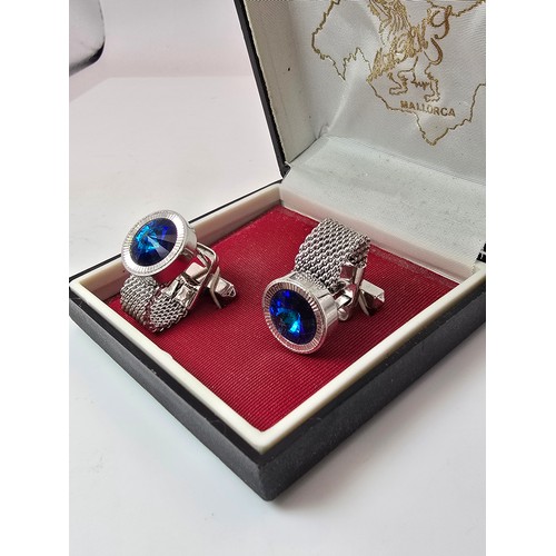 202 - 2 cased attractive pairs of gents cufflinks from Mallorca featuring a silver tone pear inset with bl... 