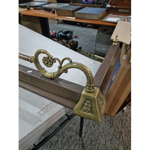 311 - Large copper and brass fire fender in good order with brass rail, scroll deisgn and brass edging has... 