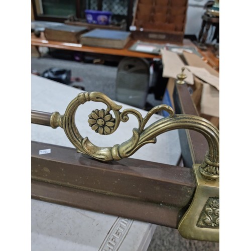 311 - Large copper and brass fire fender in good order with brass rail, scroll deisgn and brass edging has... 