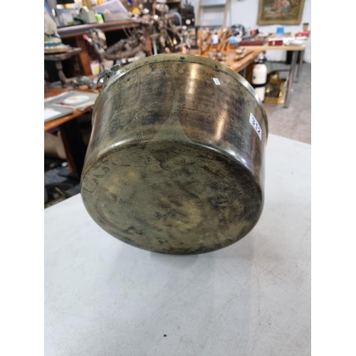 312 - Large brass jam pan in good order with cast iron handle measures 17cm high 36cm diameter