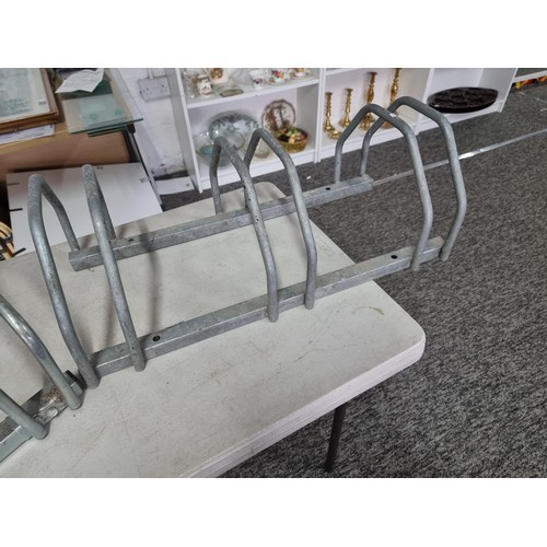 320 - Pair of good quality  bike stands each stores 3x bikes in good order, measures 27cm high 73cm long