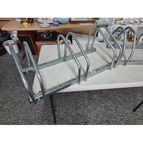 320 - Pair of good quality  bike stands each stores 3x bikes in good order, measures 27cm high 73cm long