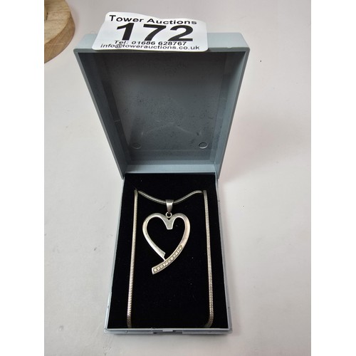 217 - A large 925 silver heart pendant inset with sparkly CZ stones, set on a good quality chunky 18