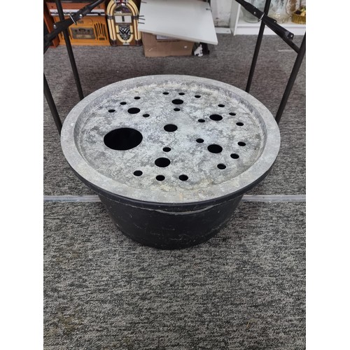 319 - Very large heavy duty plastic basin with metal top stamped E.G. with multiple holes for use as a wat... 