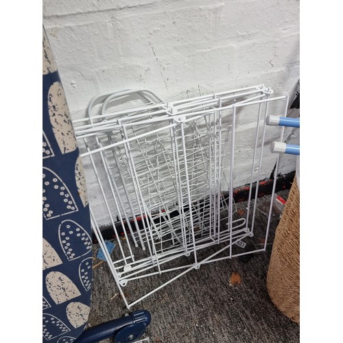 325 - Good quality lined linen basket along with an ironing board, clothes airer and a sleeve ironing boar... 