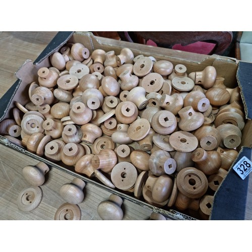 328 - Box containing a large quantity of smooth wooden door knobs, all have a 9mm square hole in them.