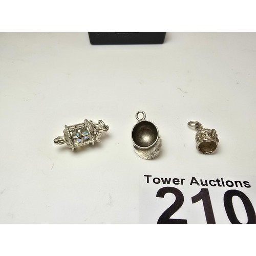 210 - 3x good quality vintage 25 silver charms for a charm bracelet to include a jockeys cap, a crown and ... 