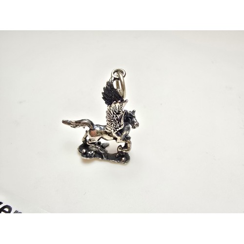 212 - 2x good quality vintage silver charms for charm bracelets to include a flying Pegasus and a lion fig... 