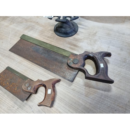 348 - Collection of 2x saws inc a short carpenters saw and one other along with a vintage cast iron 15 sta... 