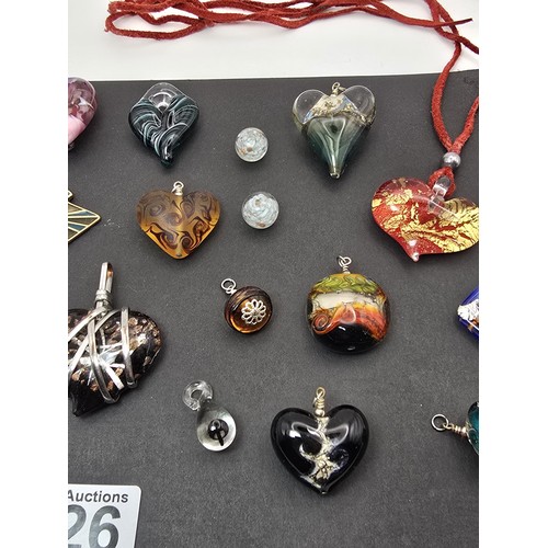 226 - A large bundle of good quality art glass pendants, all with very interesting designs,  some are made... 