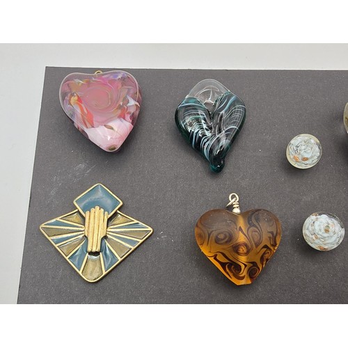 226 - A large bundle of good quality art glass pendants, all with very interesting designs,  some are made... 