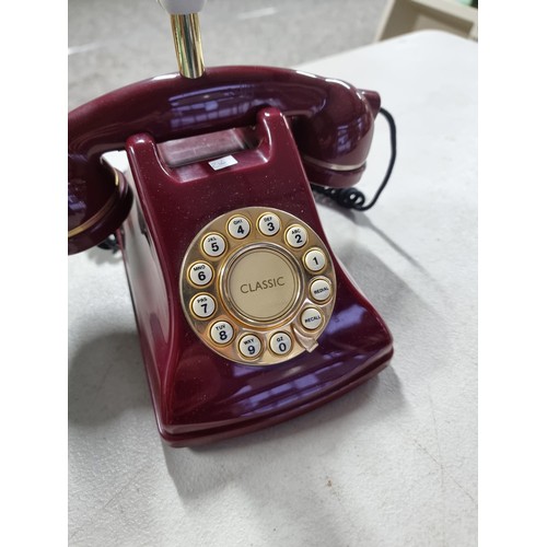 361 - Blue retro style telephone with dial to the front in working order along with a maroon coloured tele... 