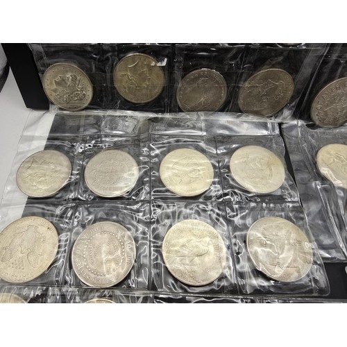 230 - A large collection of approx 48 fantasy and novelty American dollar coins of various designs, these ... 