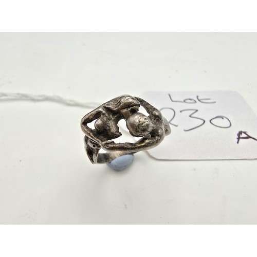 230A - An unusual good quality vintage 25 silver ring in the form of a lovers embrace, the ring is beautifu... 