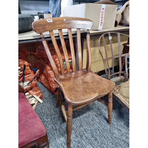 407 - Vintage solid elm slat back chair in good overall condition presenting good grain throughout standin... 