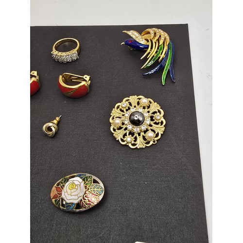 223 - A selection of brooches, earrings and a good quality dress ring, features 2 pretty enamelled bird br... 