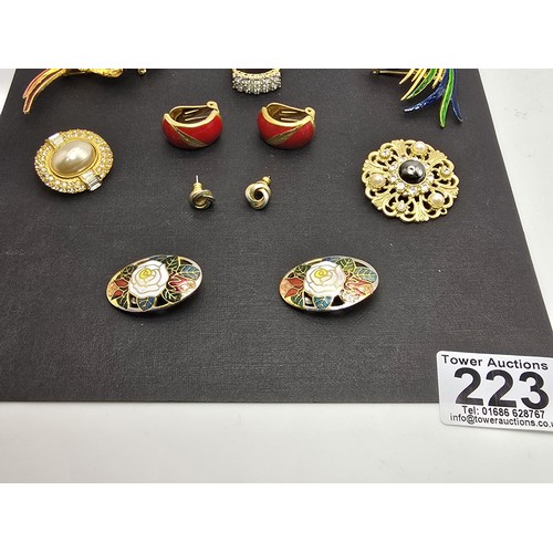 223 - A selection of brooches, earrings and a good quality dress ring, features 2 pretty enamelled bird br... 