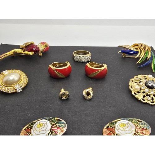 223 - A selection of brooches, earrings and a good quality dress ring, features 2 pretty enamelled bird br... 