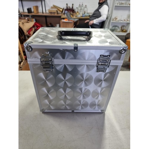 381 - Good quality sturdy aluminium record case with circular decoration to the sides and top, comes compl... 