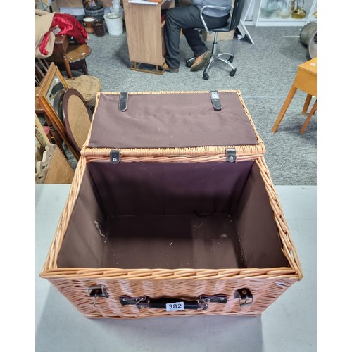 382 - Good quality wicker picnic hamper with brown cotton lined interior and leather straps to the front, ... 